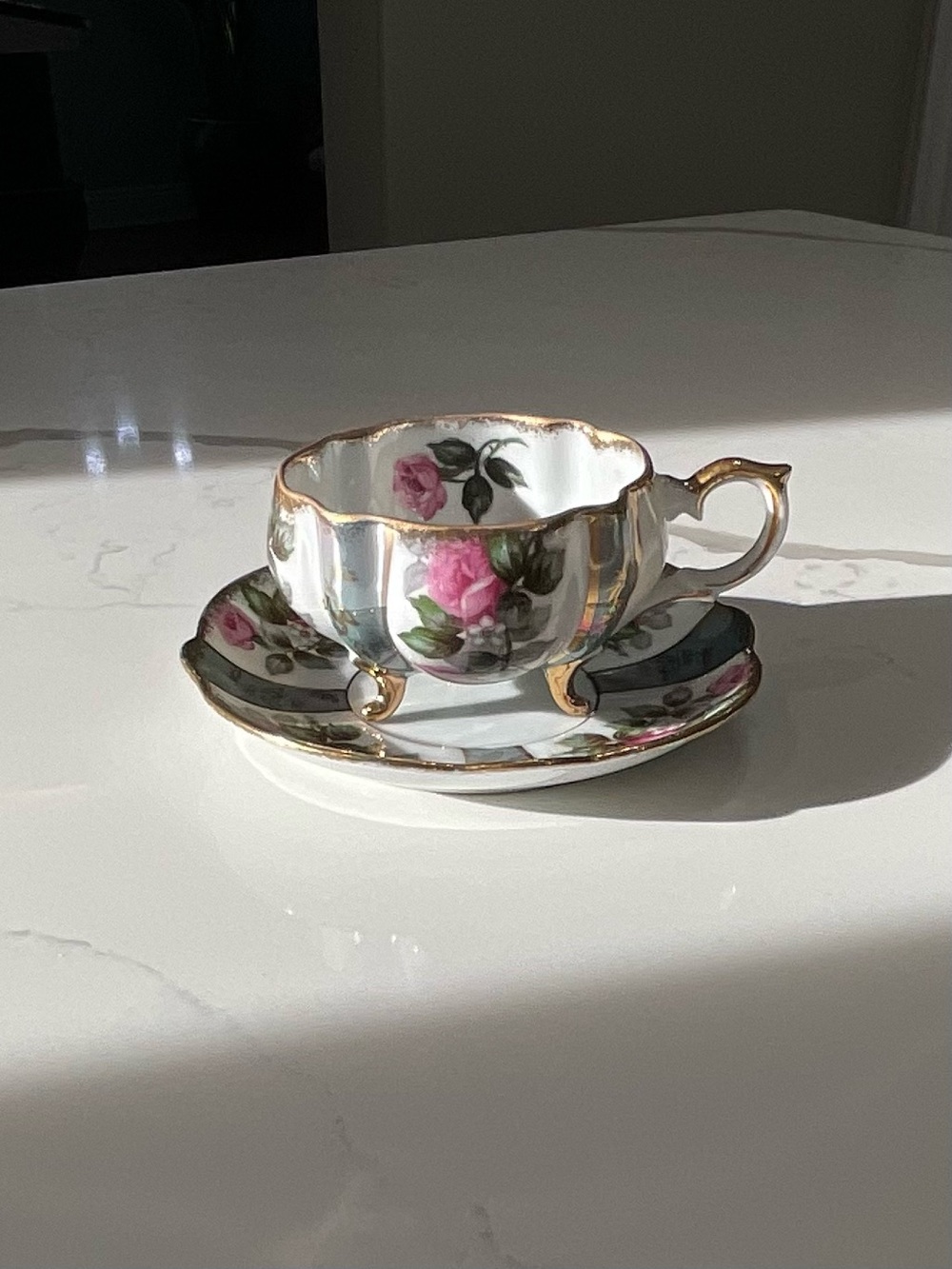 Porcelain Tea Cup and Saucer with Pink Rose Motif and Gold Trim